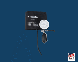 Shock-proof analog sphygmomanometer with coiled tubing, gauge, and bulb centered on blue background; TAA Compliant box with American flag in lower right corner