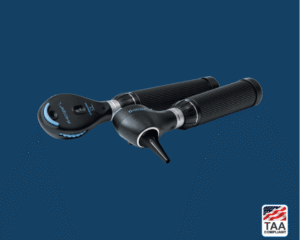 Black otoscope specula and ophthalmoscope placed side by side, positioned centrally on blue background; TAA Compliant box featuring American flag visible in lower right corner.