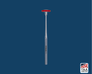 Black Babinsky-style percussion hammer with slender chrome handle and narrow triangular rubber head, positioned centrally on blue background; TAA Compliant box featuring American flag visible in lower right corner.