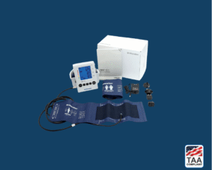 Bundled digital blood pressure monitor set with accessories and retail packaging, placed flat in center of picture with blue background. TAA Compliant symbol with American flag in bottom right-hand corner.