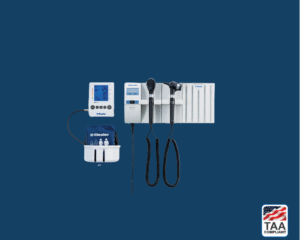 Wall-mounted digital blood pressure monitor placed flat in center of picture with blue background. TAA Compliant symbol with American flag in bottom right-hand corner.